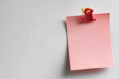 Sticky note, clip and message with mockup for agenda, tasks or post on a white studio background. Closeup of document, paper or pink page with alert, review or memo of sign for notice or notification