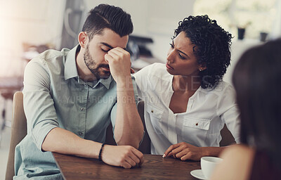 Buy stock photo Couple, comfort and man with support in stress for counseling, compassion or advice on problem. Frustrated, person and woman with therapy by table for cheating mistake, regret or kindness in bad news