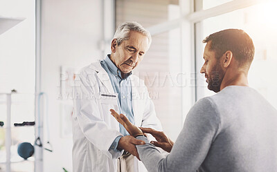 Buy stock photo Man, doctor and patient for hand inspection of wrist checkup, arthritis and exam for diagnosis assessment. Medical, people and joint pain from accident, nerve problem and healing arm for wellness