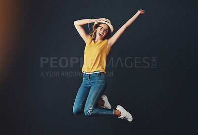 Buy stock photo Excited, jumping and studio portrait of woman for fashion, celebration and happy for news. Winner, student or gen z and discount for clothes by black background with energy, success and wow emoji