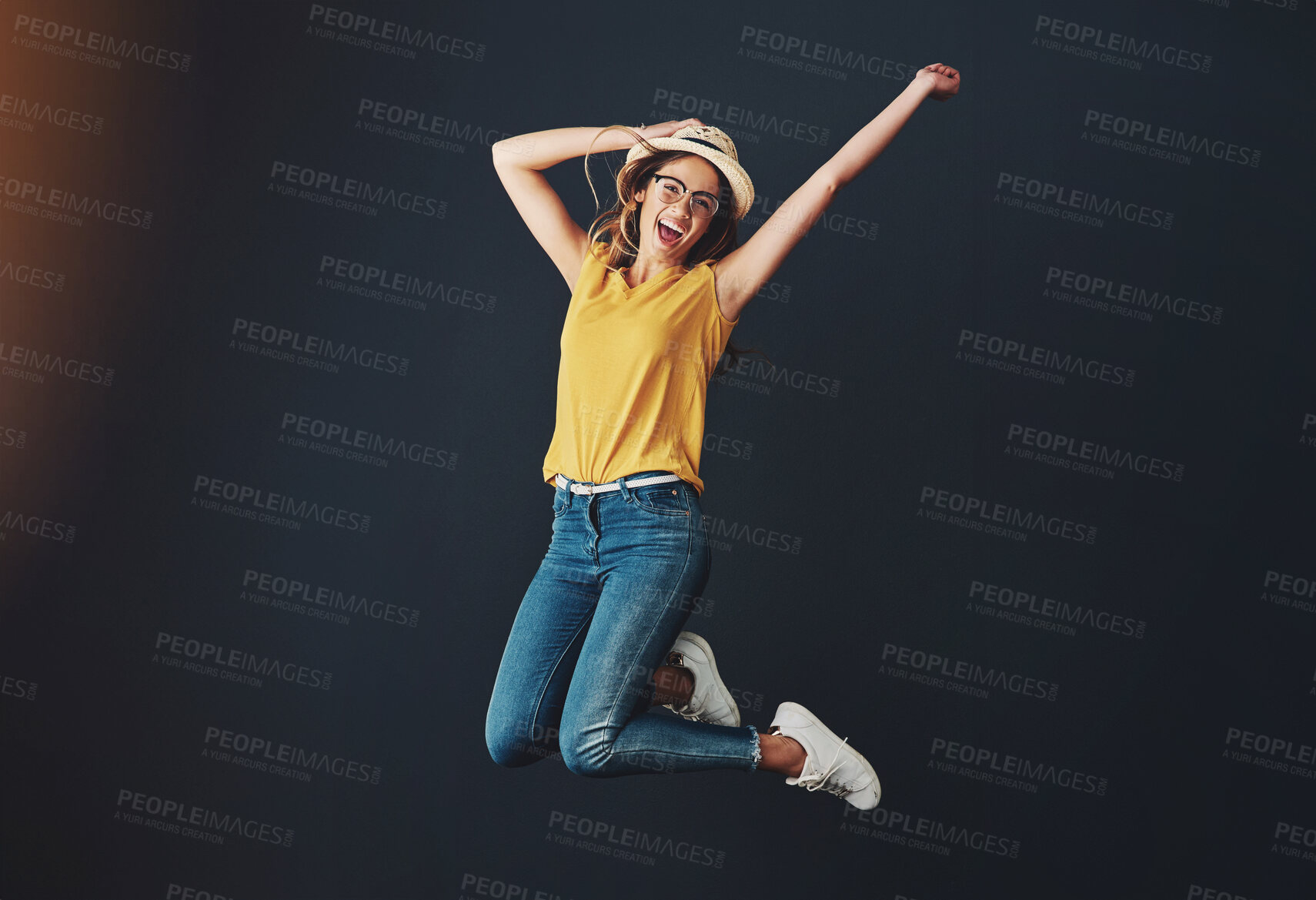 Buy stock photo Excited, jumping and studio portrait of woman for fashion, celebration and happy for news. Winner, student or gen z and discount for clothes by black background with energy, success and wow emoji