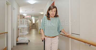 Buy stock photo Cane, walking and senior woman with disability in hospital for appointment, checkup and visit in hallway. Healthcare, corridor and female patient in clinic for help, assistance and care after injury