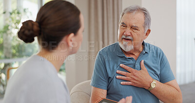 Nurse, senior and man with chest pain, communication for advice or healthcare and crisis in retirement home for care. Caregiver, mature male person and consulting for symptoms of pneumonia infection.