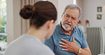 Nurse, senior and man with chest pain, communication for advice or healthcare and crisis in retirement home for care. Caregiver, mature male person and consulting for symptoms of pneumonia infection.