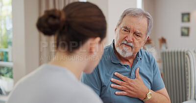 Nurse, senior and man with chest pain, communication for advice or healthcare and crisis in retirement home for care. Caregiver, mature male person and consulting for symptoms of pneumonia infection.
