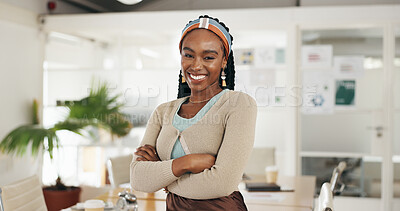 African woman, arms crossed and face at startup with smile, confidence or leadership at small business. Person, employee and happy in portrait with pride in office at creative media agency in Chicago