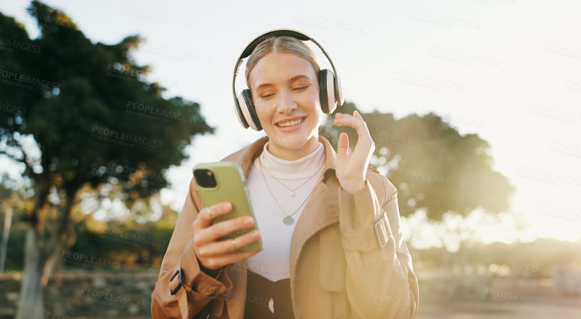 Buy stock photo Businesswoman, headphones and cellphone or park walking for work commute, streaming or podcast. Female person, dance and happiness in urban city for morning travel with music, entertainment or audio