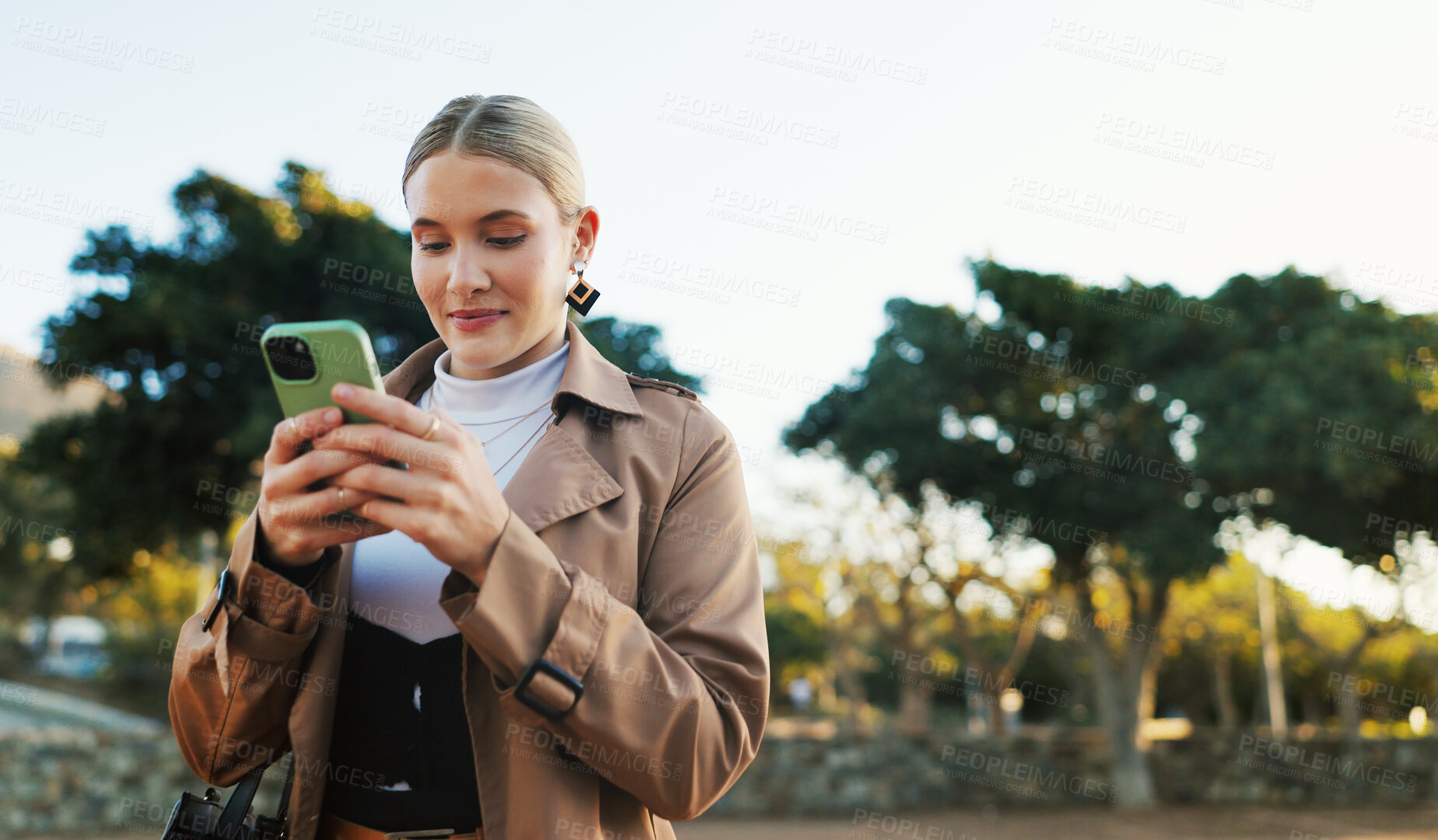 Buy stock photo Businesswoman, cellphone and park walking for work commute in morning, notification or email. Female person, smartphone and thinking in urban nature in Boston with corporate, thoughts or decision