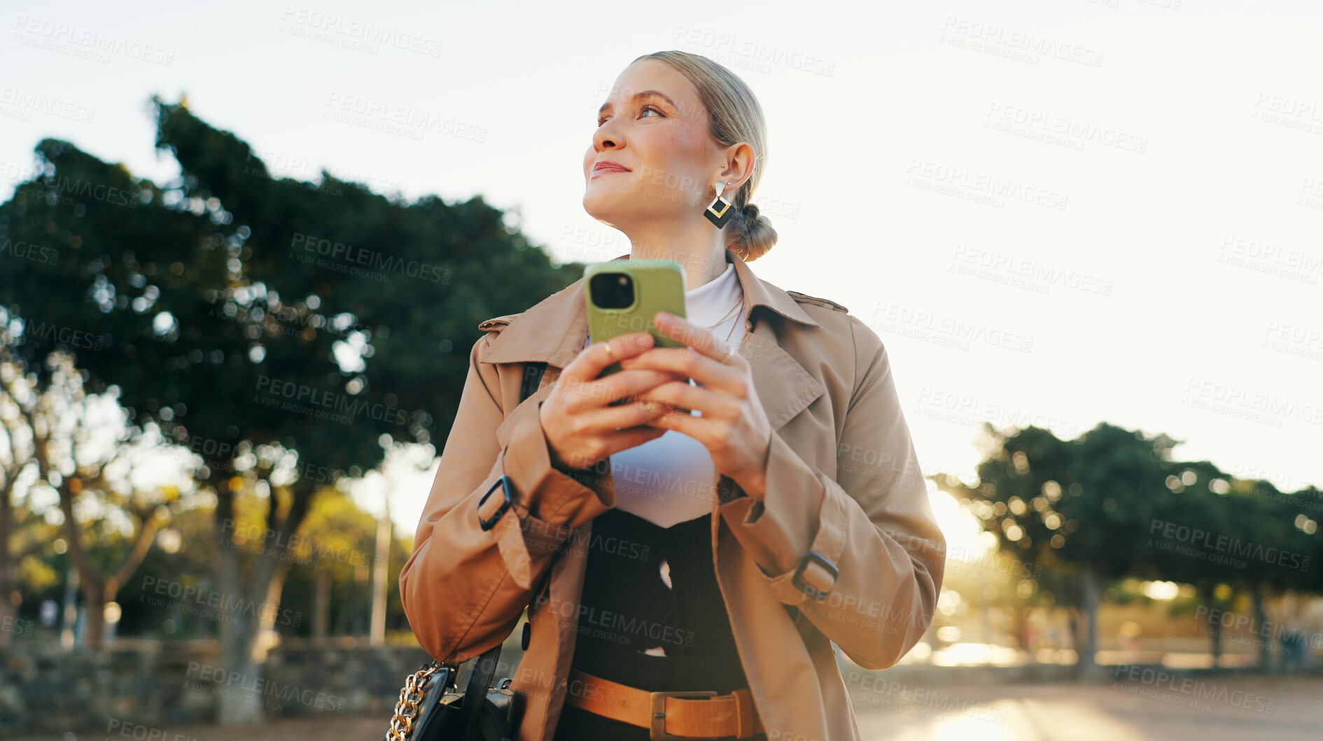 Buy stock photo Businesswoman, cellphone and park walking for work commute in morning, notification or email. Female person, smartphone and thinking in urban nature in Boston with corporate, thoughts or decision