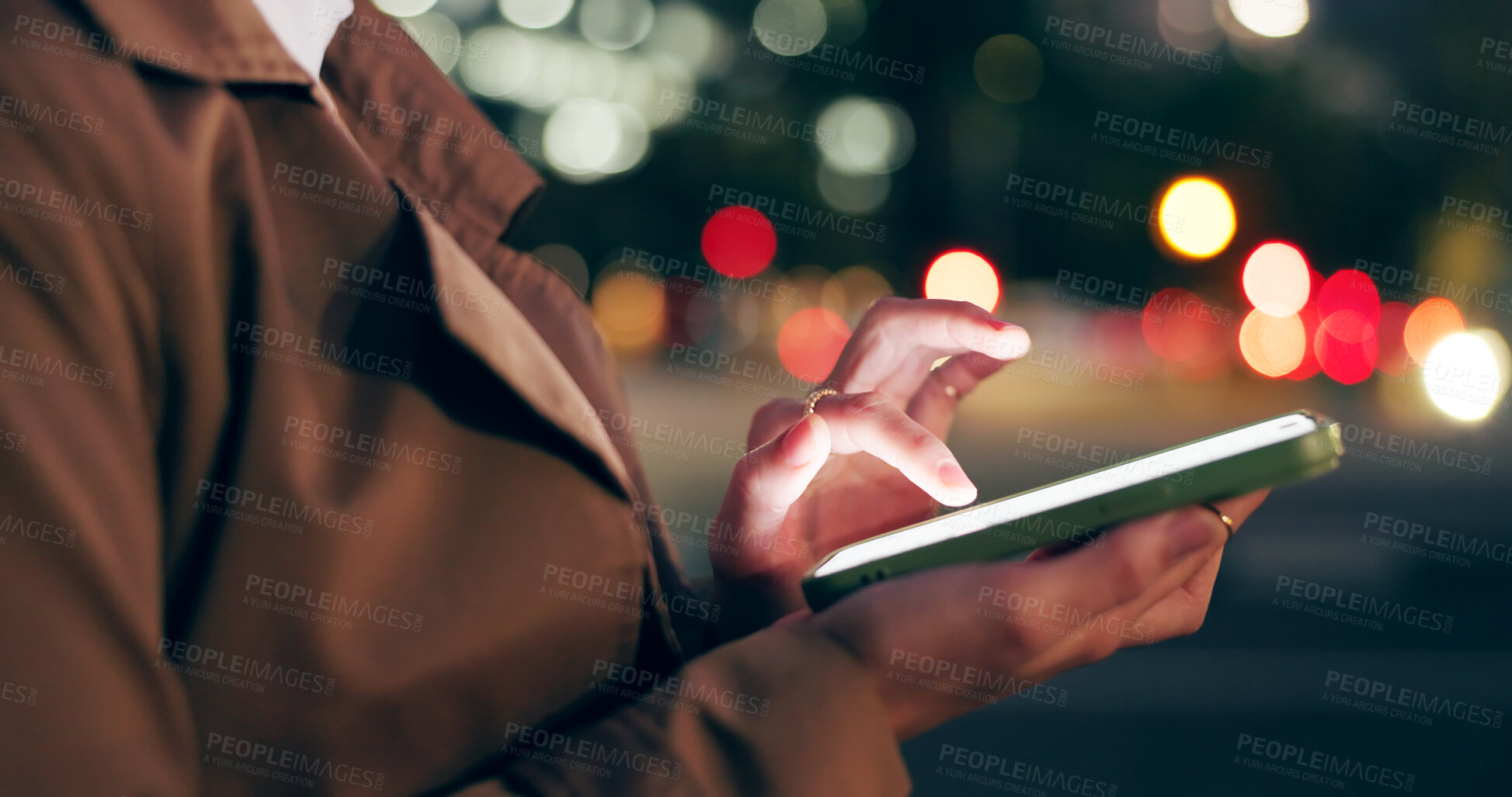 Buy stock photo Woman, hands and outdoor with texting on smartphone on smile at night for conversation on social media in New York. Female person, happy and text message for networking or communication on mobile app