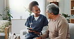 Tablet, healthcare and african nurse in home with senior man, internet and online help on sofa. Young caregiver, elderly person and technology for learning or telehealth and care in chronic illness