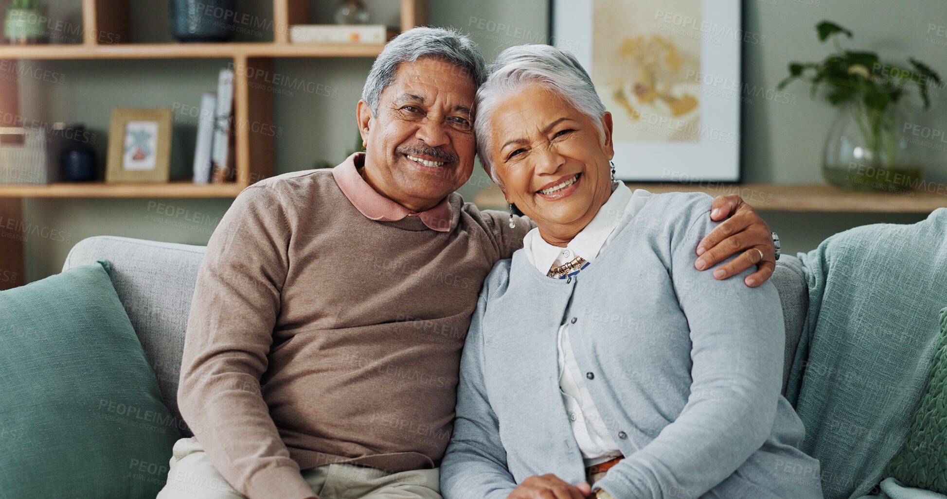 Buy stock photo Portrait, hug and portrait of old couple to relax on sofa with love in marriage, retirement or vacation. Elderly, people and together on couch in home with trust, support and bonding with kindness