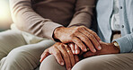 Holding hands, senior and couple with support in living room, empathy and love with care on couch. Lounge, marriage and people, elderly and retirement in house or apartment with compassion in home