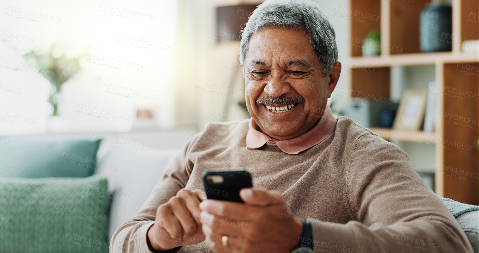 Buy stock photo Phone, excited and senior man on sofa with smile, online chat and scroll on internet in home. Connection, networking and happy old person on couch with smartphone for mobile app, good news or relax