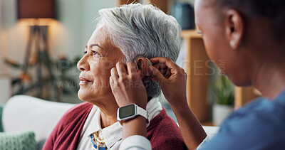 Nurse, woman and hearing aid on ear for medical support, wellness and innovation of disability. People, healthcare worker and deaf patient with audiology implant, service or help for sound waves
