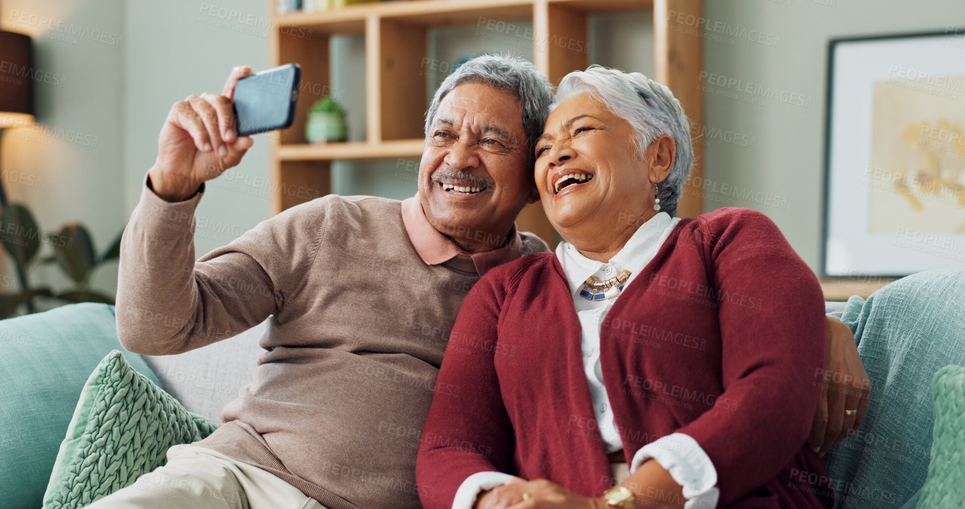 Buy stock photo Senior couple, laugh and smartphone for video call, contact and communication in living room. People, mature man and woman on sofa, selfie and house together with cellphone for online conversation