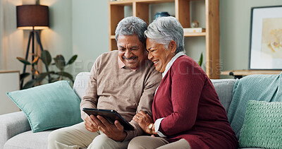 Buy stock photo Senior couple, happy and laughing with tablet, streaming and communication in living room. People, mature man and woman on funny meme, couch and house together in retirement with digital technology