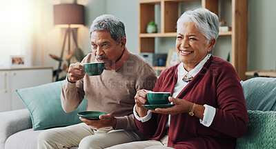 Senior couple, happy and coffee on sofa in house, home and living room for retirement. People, elderly partners and family drinking tea, laughing and relax on couch for love, bonding and affection
