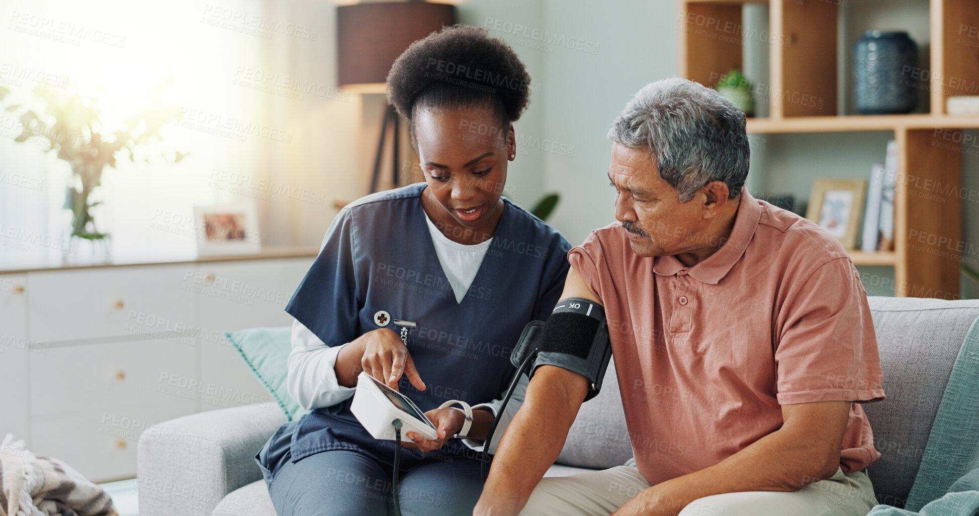 Buy stock photo Elderly man, living room and nurse with blood pressure for heart rate, cardiovascular support or exam. Senior person, healthcare and medical machine on sofa for hypertension, results and consultation