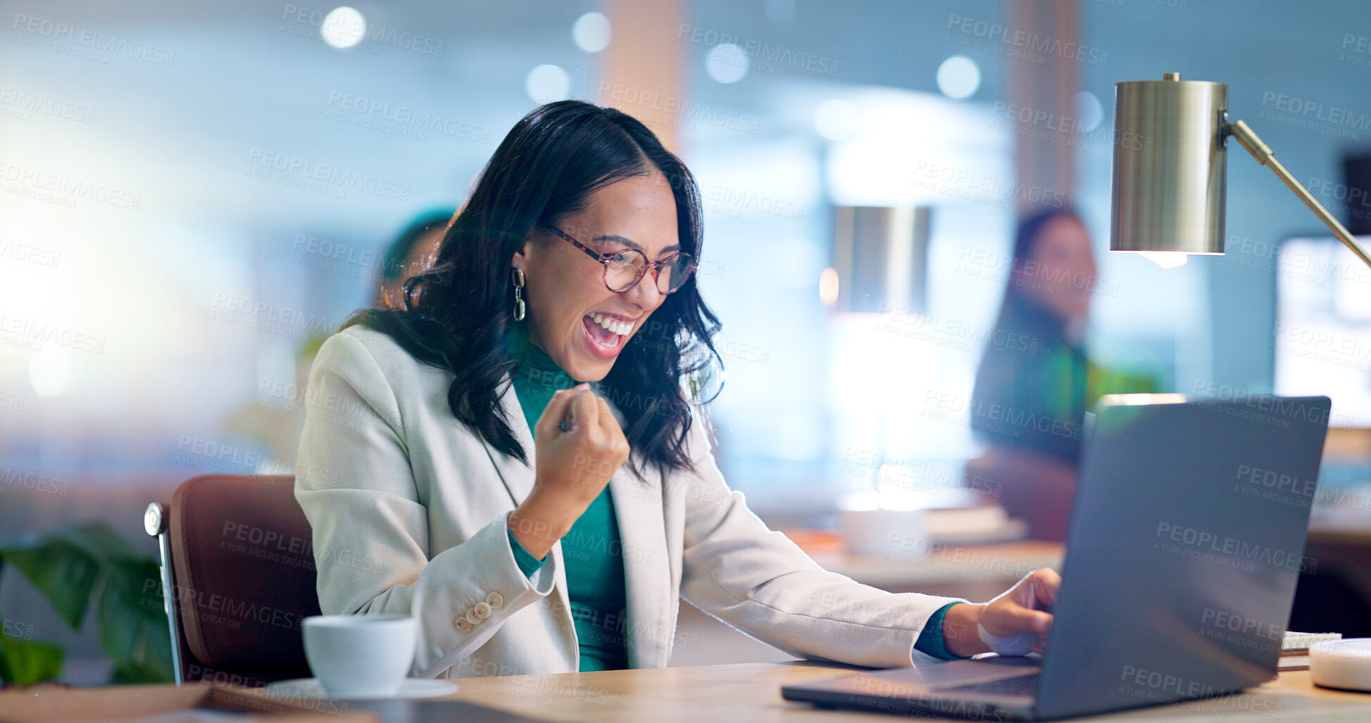 Buy stock photo Woman, fist and winning in office by laptop with wow, celebration and success with financial achievement in night. Person, employee and pc with cheers, goals and profit with trading on stock market