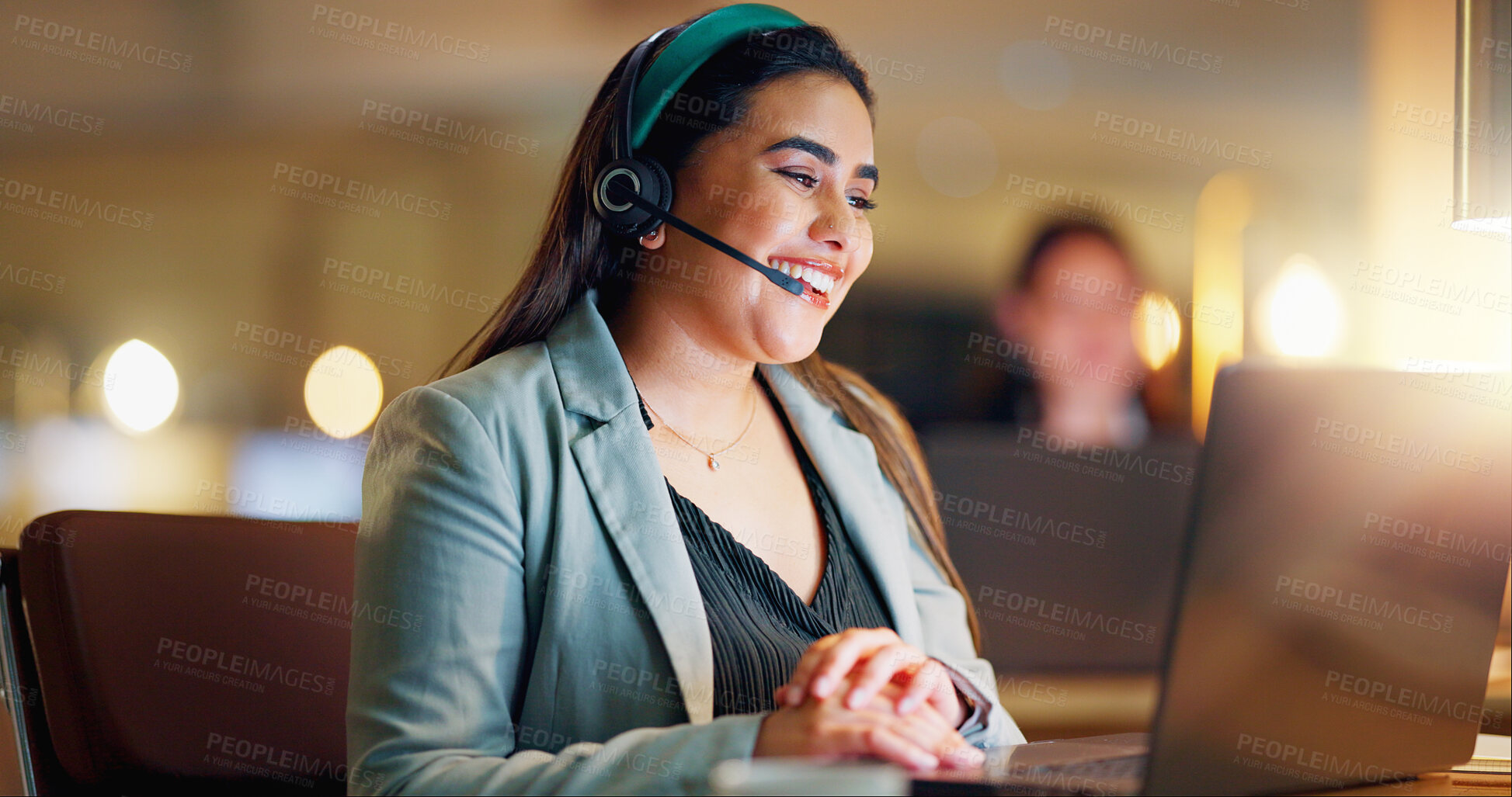 Buy stock photo Happy woman, call center and communication with headset at night in office for customer service, lead generation. Person, CRM and laptop with faq for telecom support, contact and telemarketing advice