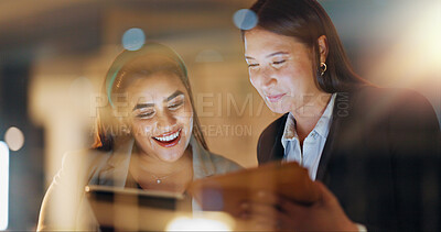 Buy stock photo Laptop, tablet and collaboration with business people at night in the office together for teamwork. Technology, smile and a happy employee team of women working on a project or report in the evening