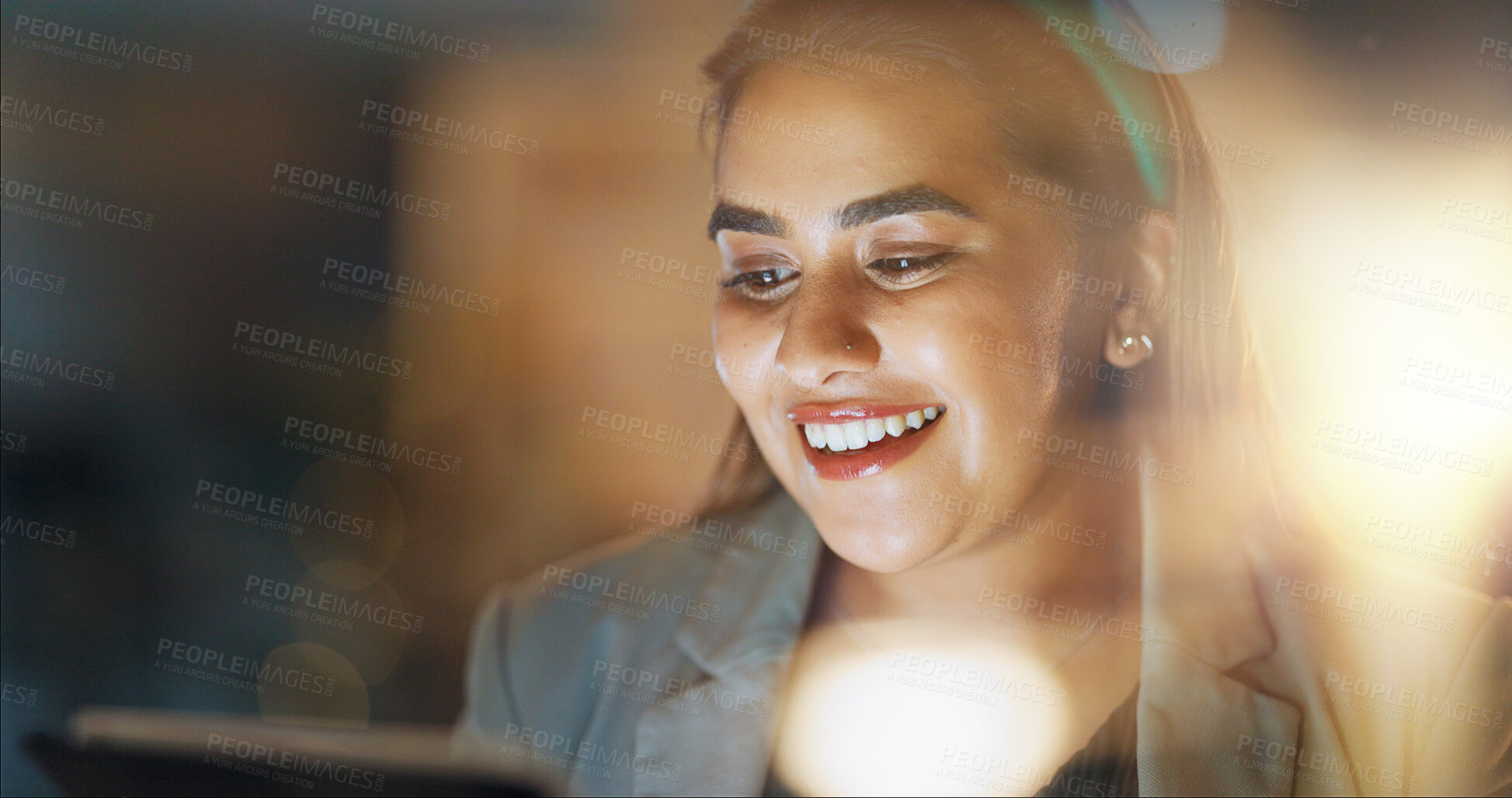 Buy stock photo Business, woman and tablet at night in office for planning research, online report or internet information. Face of happy indian employee working late on social network, scroll website or digital app