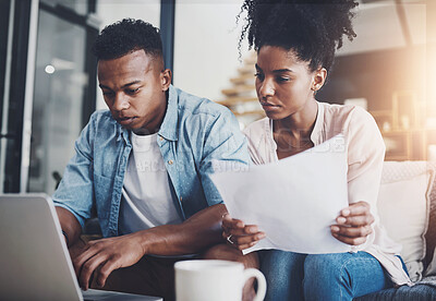 Buy stock photo Couple, laptop and serious with paperwork for finance on sofa with planning taxes or loan application in home. Black people, technology and documents for mortgage contract and insurance investment