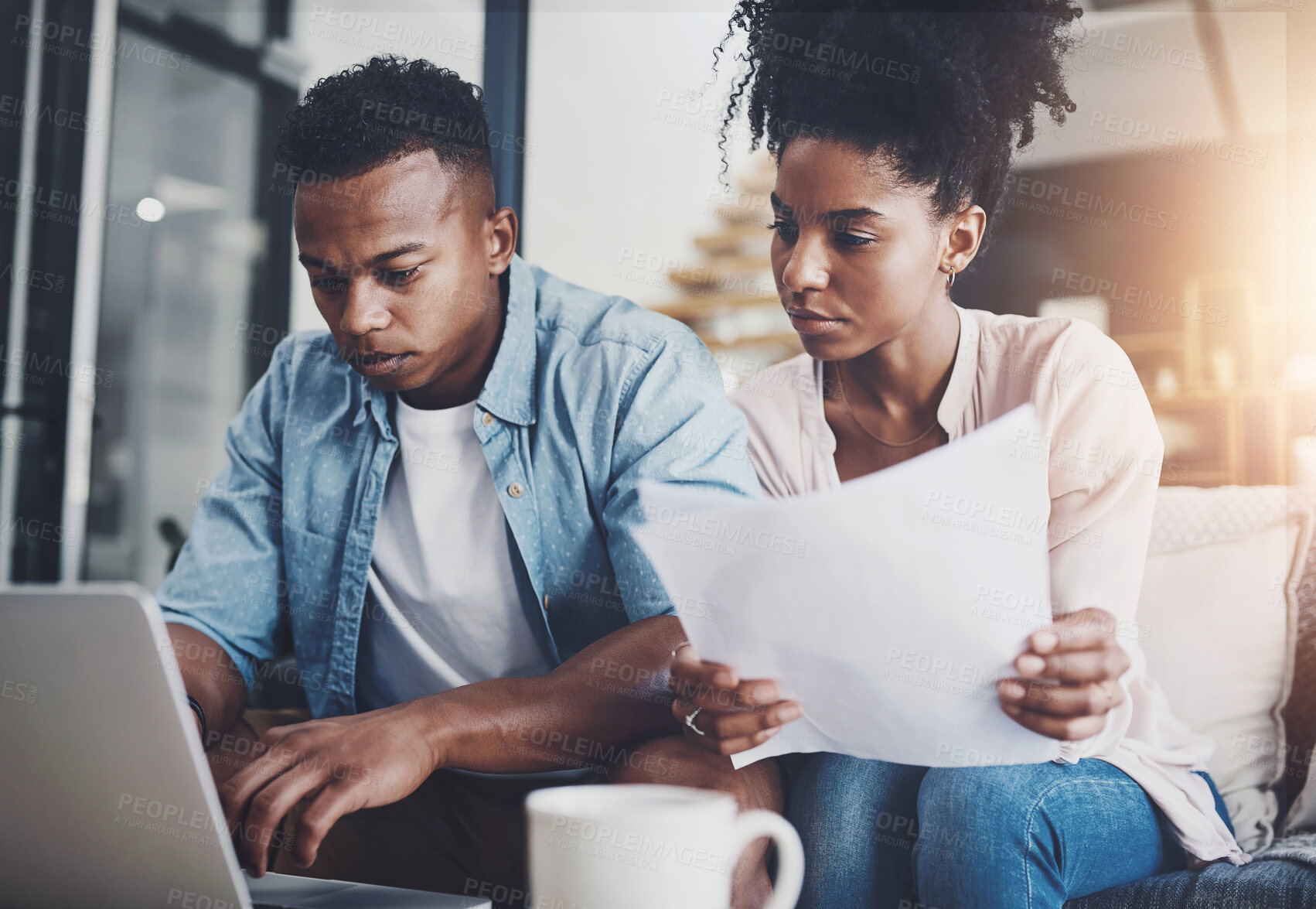 Buy stock photo Couple, laptop and serious with paperwork for finance on sofa with planning taxes or loan application in home. Black people, technology and documents for mortgage contract and insurance investment