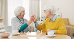 Senior woman, friends and high five for chess match, game or winning on table together at home. Happy elderly women in celebration, playing strategic board game for victory or checkmate in retirement