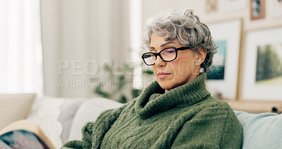 Buy stock photo Woman reading funny book in living room for story, novel and knowledge in retirement. Happy senior female person relax with books in lounge for break, literature and hobby to enjoy on sofa at home