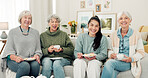 Senior women, tea and portrait of friends at a retirement home for quality time, chat or relax. Elderly people or group with a happy caregiver on a sofa for food and social visit while funny together