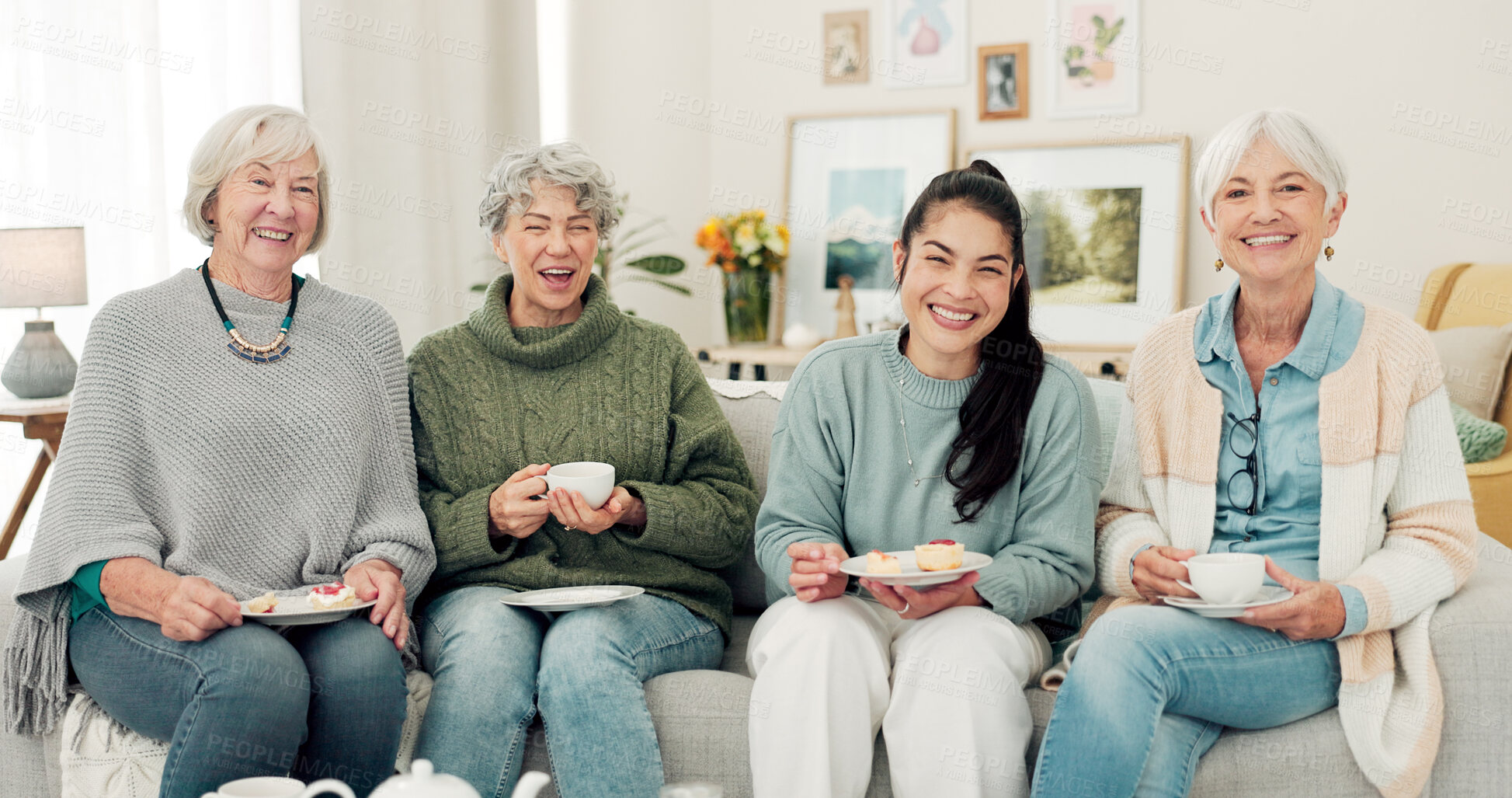 Buy stock photo Senior women, tea and portrait of friends at a retirement home for quality time, chat or relax. Elderly people or group with a happy caregiver on a sofa for food and social visit while funny together