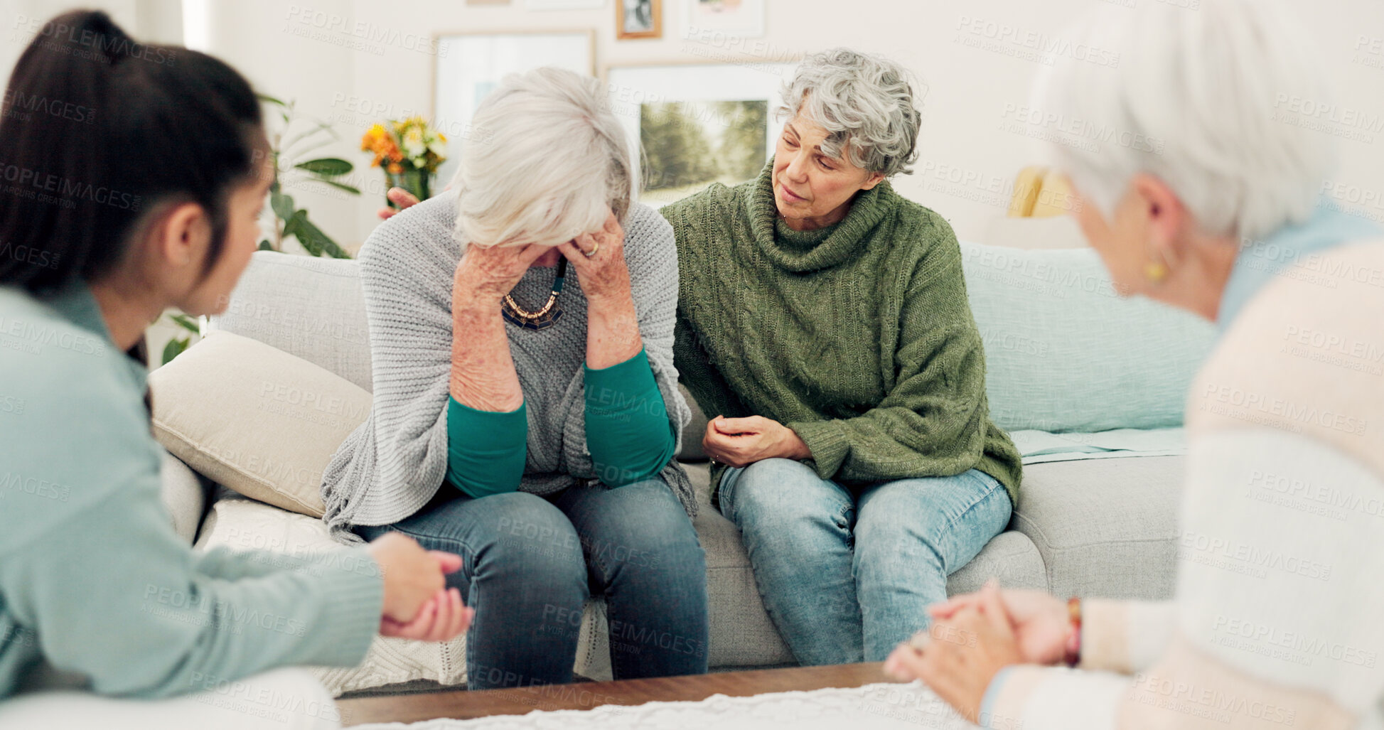 Buy stock photo Sympathy, grief and elderly woman with family crying for loss, sadness or depression in living room. Mental health, emotions and senior female person comforting friend in sorrow for empathy at home.