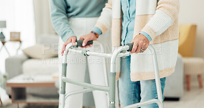 Buy stock photo Woman, hands and walker in elderly care for physiotherapy, support or trust at old age home. Closeup of female nurse or caregiver walking and helping patient or person with a disability in the house