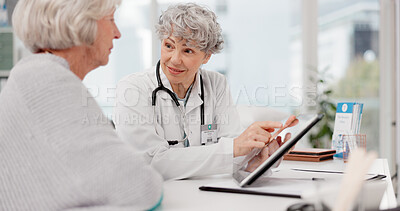 Senior doctor, tablet and talking to patient for healthcare prescription or diagnosis at hospital. Mature medical professional consulting elderly female person on technology for help advice at clinic