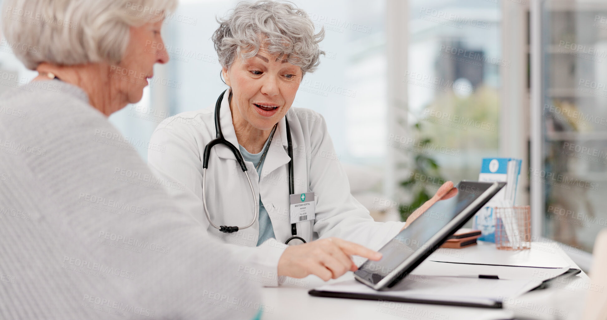 Buy stock photo Senior doctor, tablet and discussion with patient for healthcare prescription or diagnosis at hospital. Mature medical professional talking to elderly female person on technology for consultation