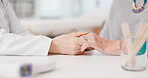 Senior woman, doctor and holding hands with patient in elderly care, love or consultation at the hospital. Closeup of medical professional touching hand for healthcare trust, support or appointment