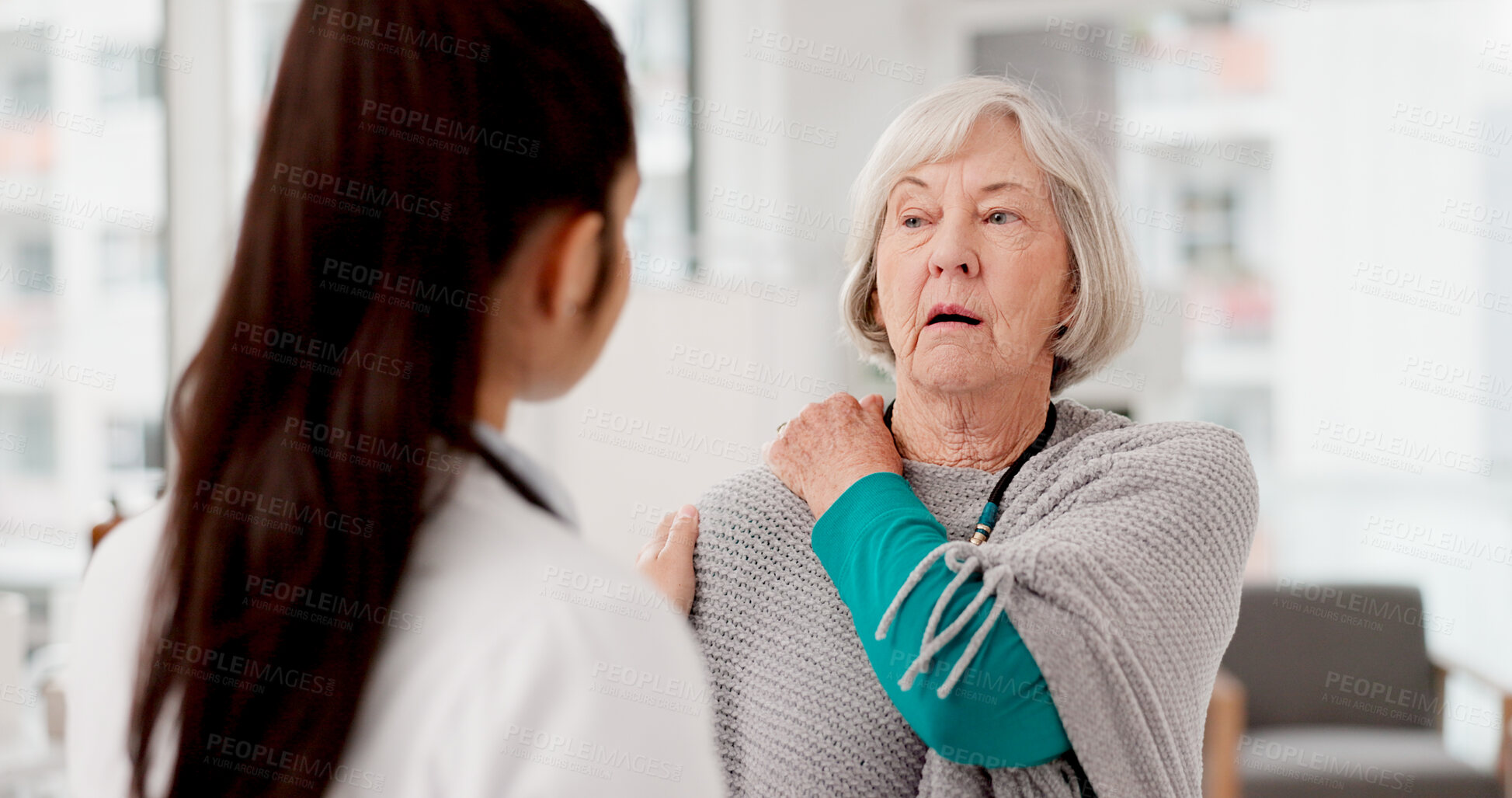 Buy stock photo Healthcare, shoulder pain and a woman with her doctor in the hospital, talking during a consultation. Medical, insurance or anatomy and senior female patient in a clinic with a medicine professional