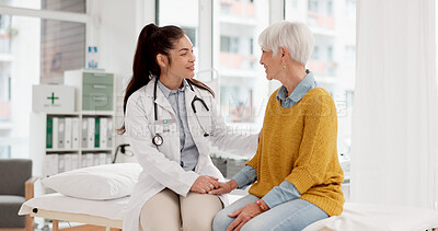 Buy stock photo Holding hands, happy or doctor with patient in consultation for healthcare advice or checkup at hospital. Support, cancer therapy or medical worker talking to person in appointment for medicare