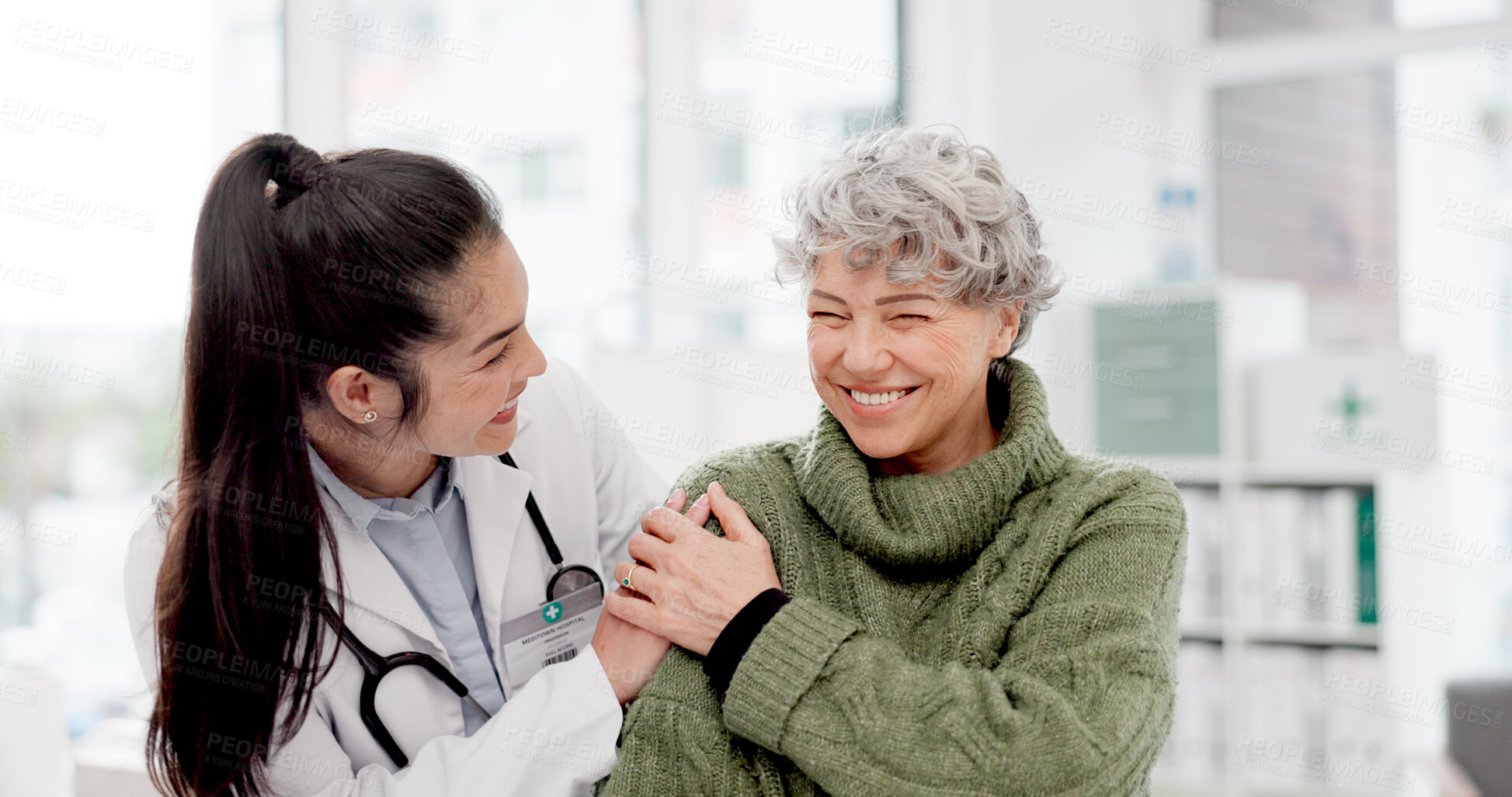 Buy stock photo Happy, care and face of a doctor with a woman for medical trust, healthcare and help. Laughing, hug and portrait of a young nurse with a senior patient and love during a consultation at a clinic