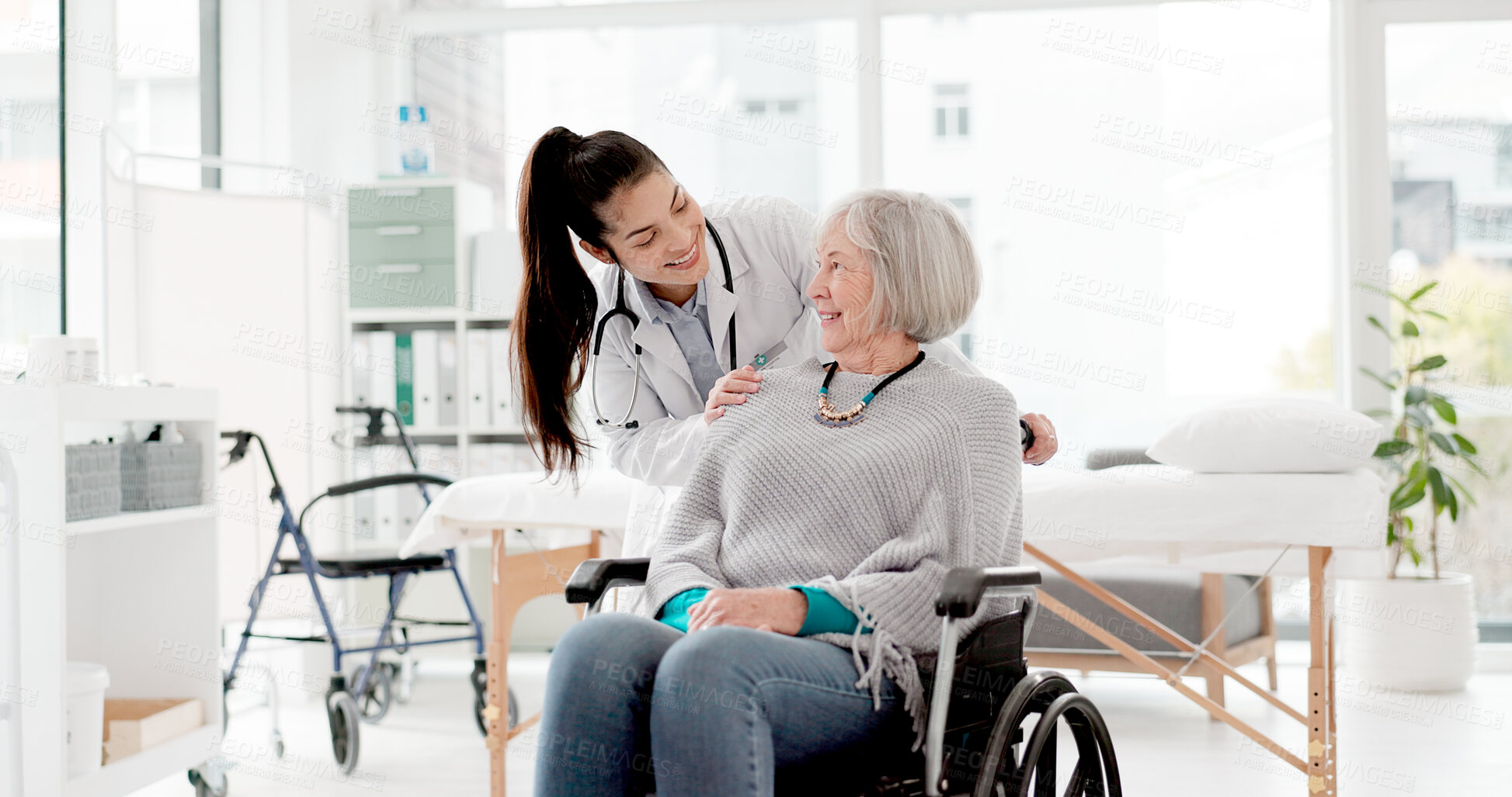 Buy stock photo Happy, senior care and woman with a disability and doctor for healthcare, support and consulting. Smile, love and face portrait of a medical employee and elderly patient in a wheelchair at a clinic