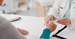 Hands, signature and doctor with patient and paperwork for healthcare and insurance. Talking, hospital and a medical employee with documents or a contract for a person while consulting for cardiology