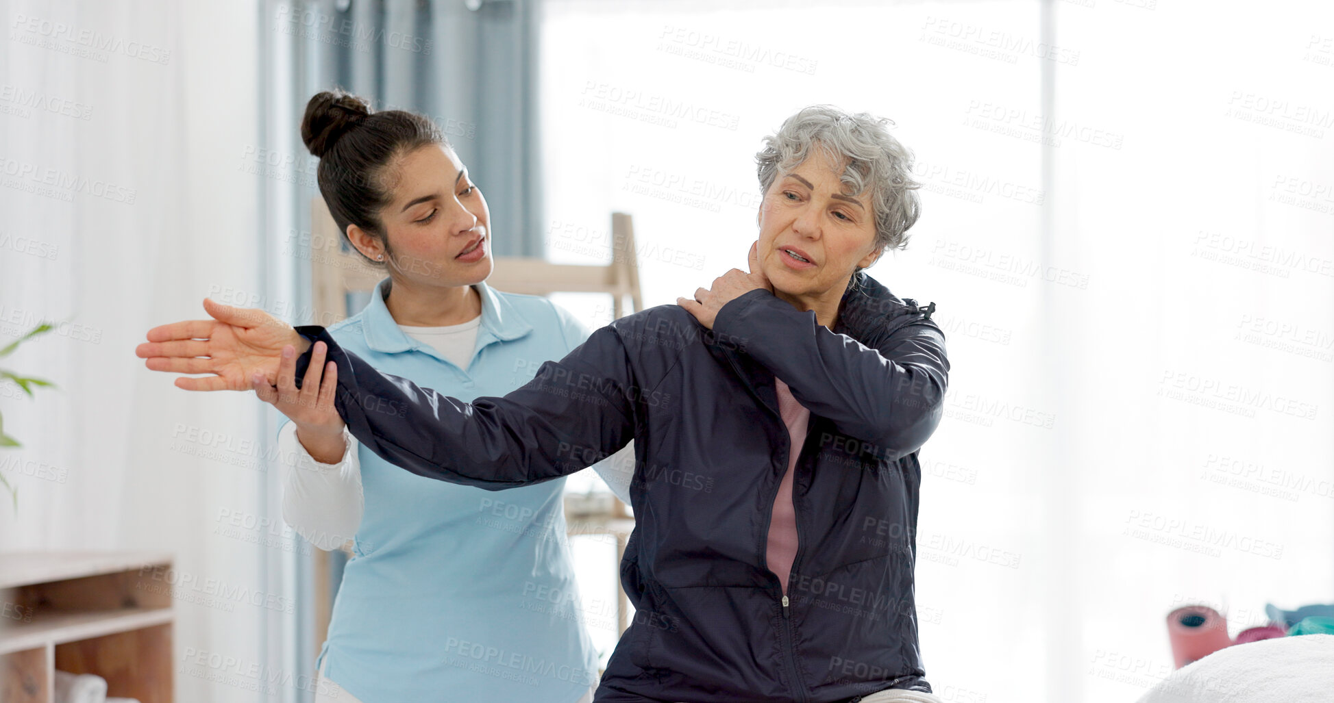 Buy stock photo Physiotherapy, arm and senior woman consulting physiotherapist for injury, healthcare and osteoporosis. Chiropractor, stretch or old person with pain, shoulder and rehabilitation with medical problem