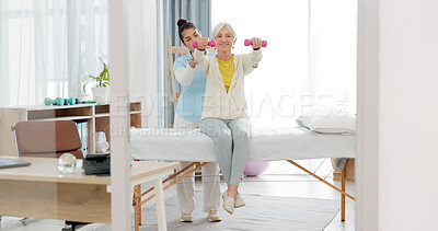 Buy stock photo Physiotherapy, senior woman with dumbbell and nurse in clinic for rehabilitation, fitness and support in healthcare exercise. Physical therapy, help and training with a physiotherapist in hospital