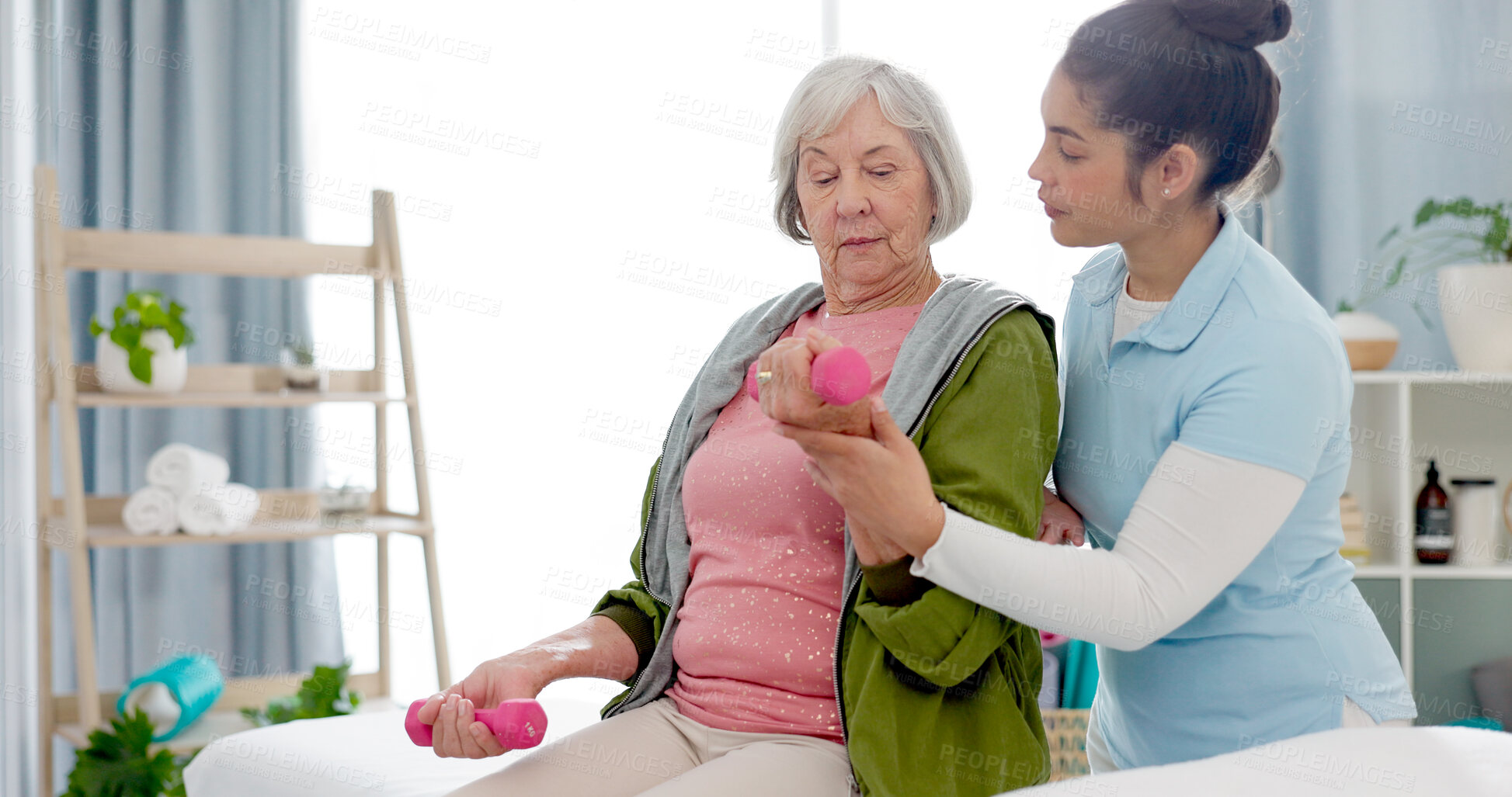 Buy stock photo Senior woman, physiotherapy with dumbbell and nurse in clinic for rehabilitation, help and support in healthcare exercise. Physical therapy, fitness and training with a physiotherapist in hospital