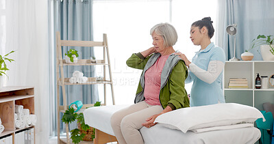 Buy stock photo Physiotherapy, massage and senior woman consulting physiotherapist for injury, wellness and osteoporosis. Chiropractor, shoulders or old person with pain, service and rehabilitation with conversation