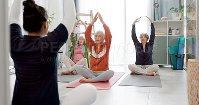 Senior people, yoga class and coach in meditation, lotus and prayer hands for exercise, holistic wellness and stretching. Workout, peace and calm of elderly woman, clients and zen personal trainer