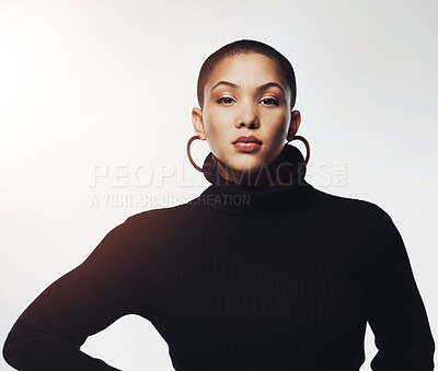 Buy stock photo Style, serious and portrait of woman in studio with winter, trendy and elegant jersey for outfit. Earrings, fashion and face of female model with classy clothes by white background with mockup space.