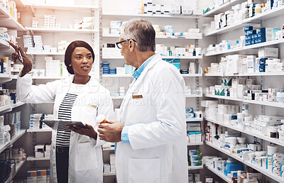 Buy stock photo Healthcare, people and discussion with tablet in pharmacy for inventory, inspection and prescription. Medical, intern and pharmaceutical student with mentor by pills for dispensary, supply and advice